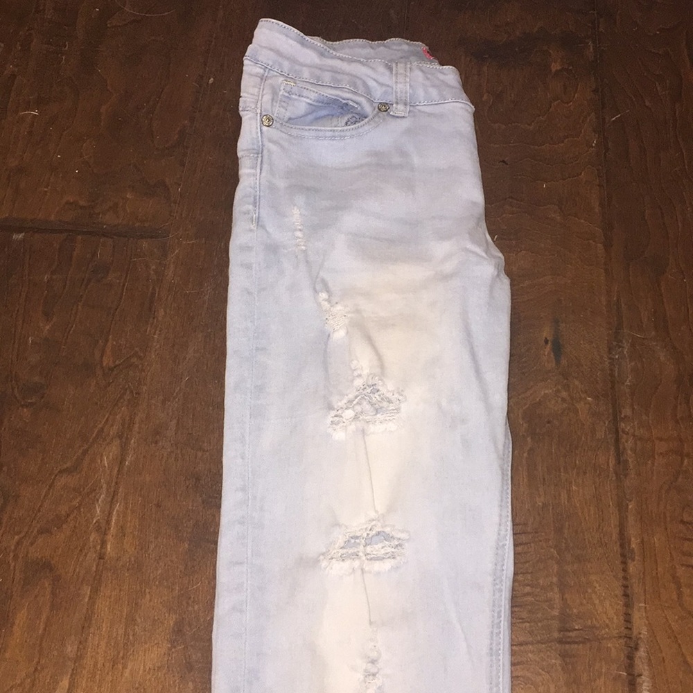 Slightly ripped light blue jeans